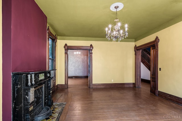 2153 Sinton Ave, Cincinnati, OH 45206 - unfurnished living room featuring a chandelier and wood finished floors