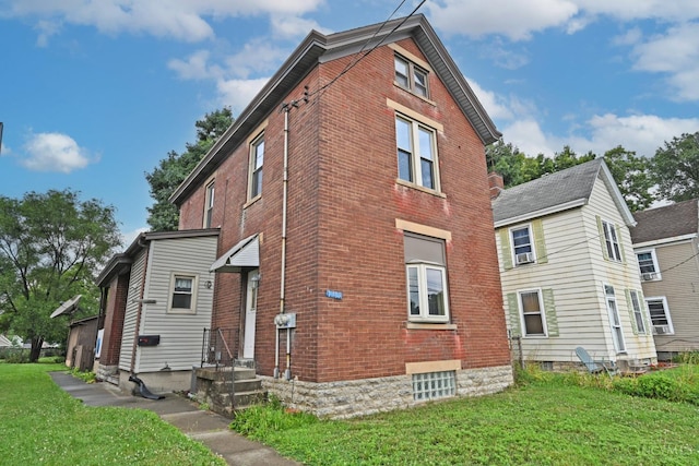 1319 Jefferson Ave, Reading, OH 45215 - view of property exterior with brick siding and a lawn