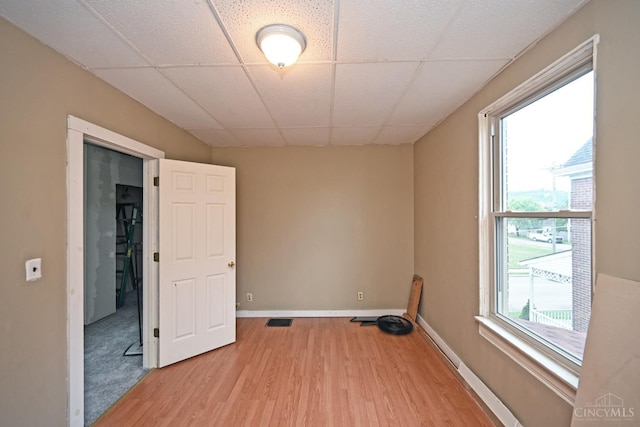 1319 Jefferson Ave, Reading, OH 45215 - unfurnished room featuring light wood-type flooring and a paneled ceiling