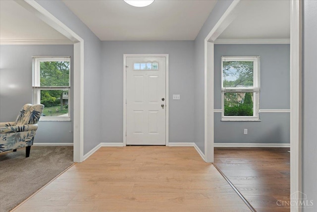 5577 Dove Ln, West Chester, OH 45069 - foyer entrance with healthy amount of natural light, light wood-style flooring, and crown molding