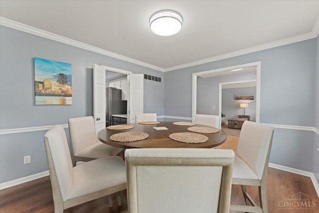 5577 Dove Ln, West Chester, OH 45069 - dining space featuring wood finished floors and ornamental molding