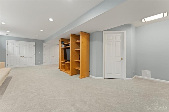 5577 Dove Ln, West Chester, OH 45069 - finished basement with light colored carpet and recessed lighting