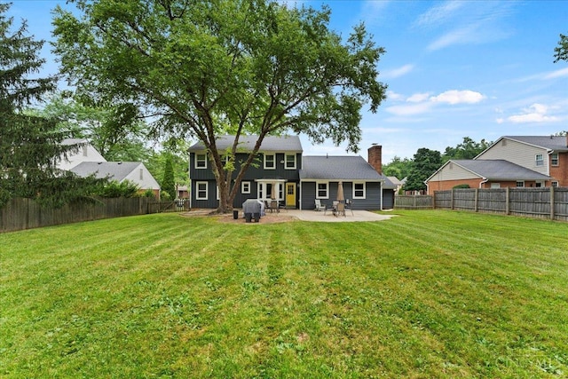 5577 Dove Ln, West Chester, OH 45069 - rear view of property featuring a patio area, a fenced backyard, and a chimney