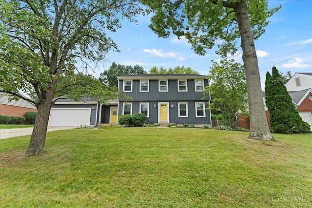 5577 Dove Ln, West Chester, OH 45069 - colonial home with concrete driveway, an attached garage, and a front lawn