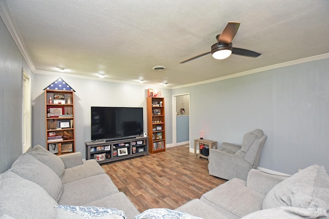1008 Garden Ave, Middletown, OH 45044 - living room with wood finished floors, ornamental molding, a ceiling fan, and a textured ceiling