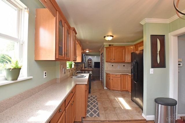1008 Garden Ave, Middletown, OH 45044 - kitchen featuring black refrigerator with ice dispenser, glass insert cabinets, tasteful backsplash, ornamental molding, and light tile patterned floors