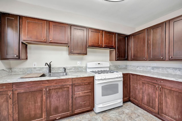 7866 Stillwell Rd, Cincinnati, OH 45237 - kitchen featuring white range with gas stovetop and a sink