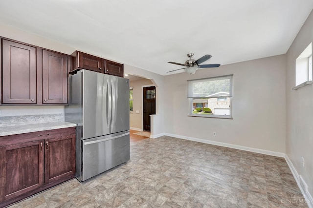 7866 Stillwell Rd, Cincinnati, OH 45237 - kitchen with freestanding refrigerator, plenty of natural light, a ceiling fan, and light countertops