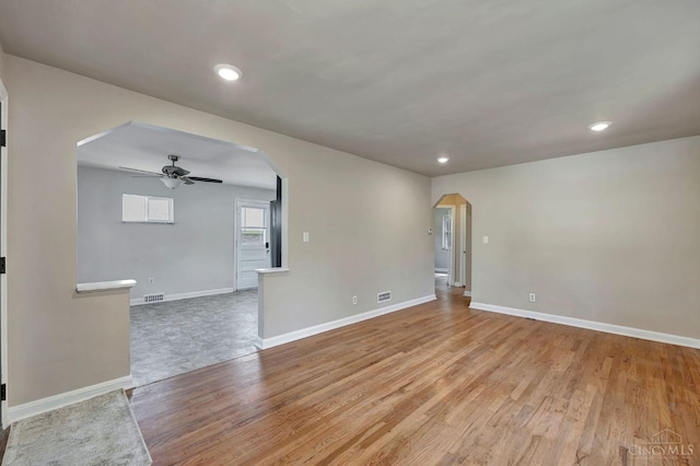 7866 Stillwell Rd, Cincinnati, OH 45237 - unfurnished room with arched walkways, ceiling fan, light wood-style floors, and recessed lighting