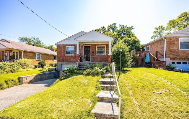 7866 Stillwell Rd, Cincinnati, OH 45237 - view of front facade featuring driveway, brick siding, a garage, stairway, and a front yard