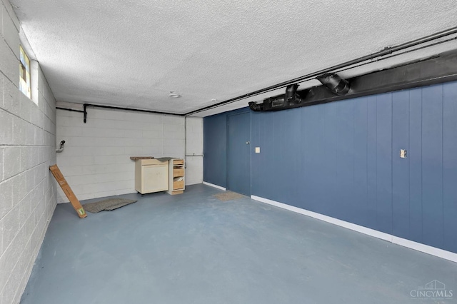 7866 Stillwell Rd, Cincinnati, OH 45237 - finished below grade area featuring a textured ceiling and concrete block wall