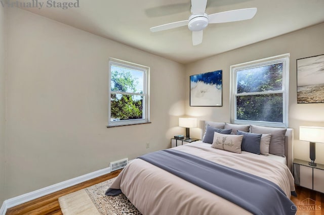 7866 Stillwell Rd, Cincinnati, OH 45237 - bedroom with wood finished floors and a ceiling fan