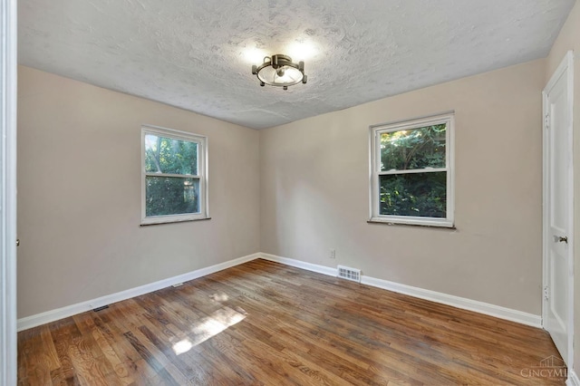 7866 Stillwell Rd, Cincinnati, OH 45237 - spare room featuring a textured ceiling and wood finished floors