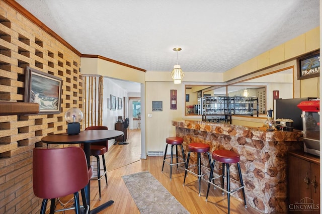 600 Kathryn Dr, Wilmington, OH 45177 - kitchen with a textured ceiling, wood finished floors, and pendant lighting