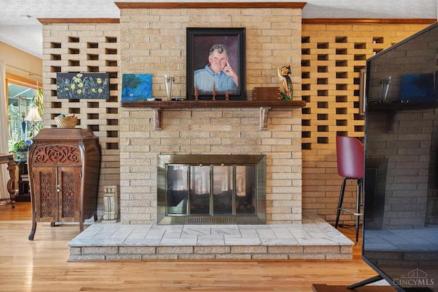 600 Kathryn Dr, Wilmington, OH 45177 - living room with a fireplace, wood finished floors, and crown molding