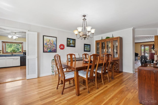 600 Kathryn Dr, Wilmington, OH 45177 - dining area with light wood-style flooring, a chandelier, ceiling fan, and crown molding