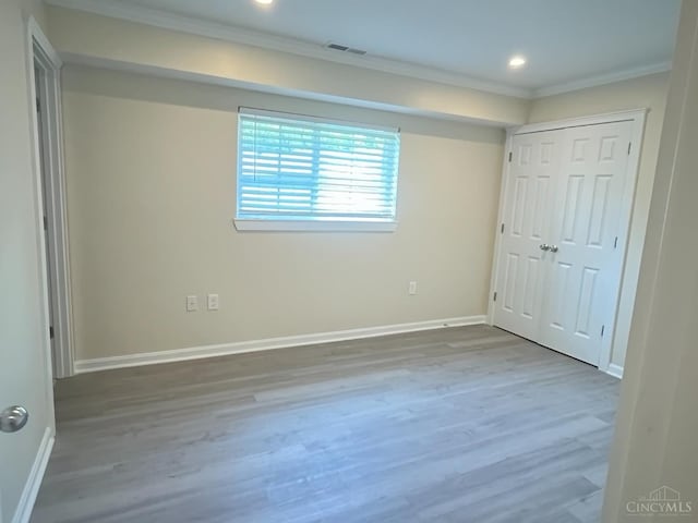 1605 W Augusta Blvd Unit 180, Fairfield, OH 45014 - unfurnished bedroom with crown molding, wood finished floors, recessed lighting, and a closet