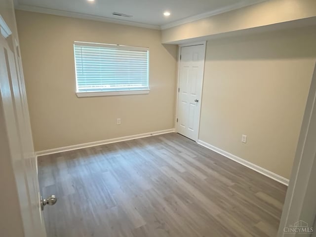 1605 W Augusta Blvd Unit 180, Fairfield, OH 45014 - unfurnished bedroom featuring crown molding, wood finished floors, and recessed lighting