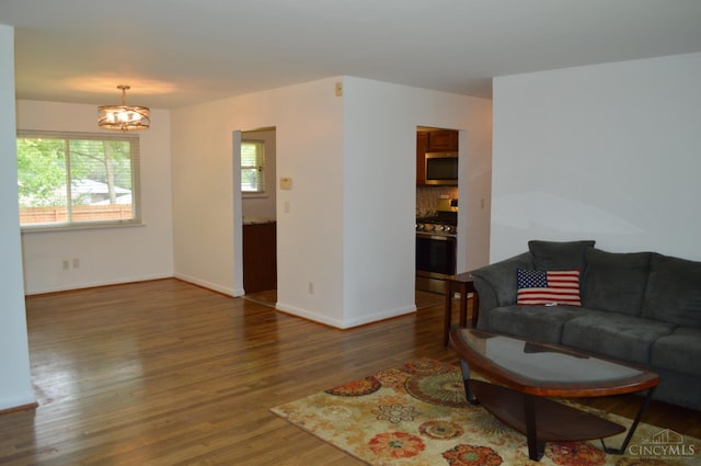 11528 Kenn Rd, Forest Park, OH 45240 - living room featuring wood finished floors and a chandelier