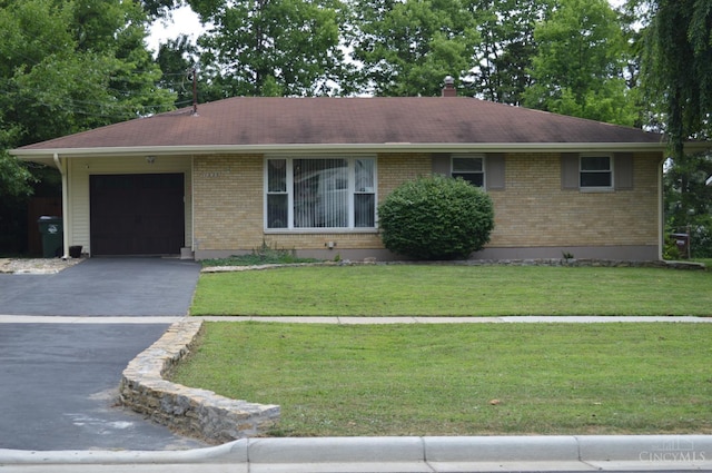 11528 Kenn Rd, Forest Park, OH 45240 - single story home featuring an attached garage, asphalt driveway, and brick siding