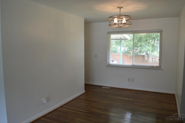 11528 Kenn Rd, Forest Park, OH 45240 - spare room with a chandelier and dark wood-style flooring