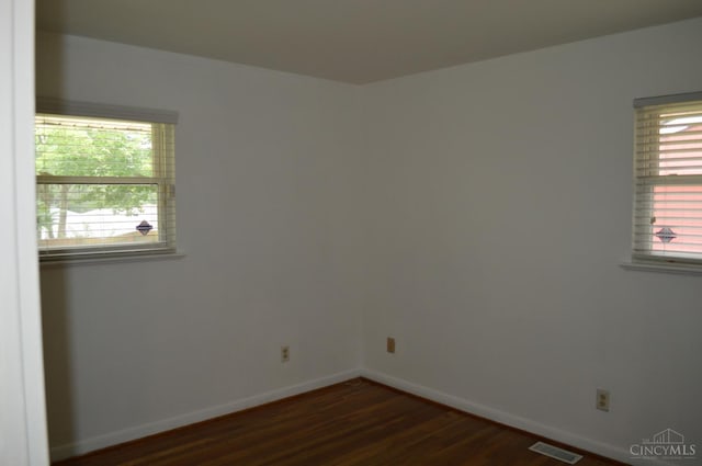 11528 Kenn Rd, Forest Park, OH 45240 - empty room with dark wood finished floors and baseboards
