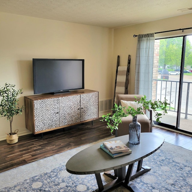 541 Davis Rd Unit 8, Pierce Twp, OH 45255 - living room featuring wood finished floors and a textured ceiling