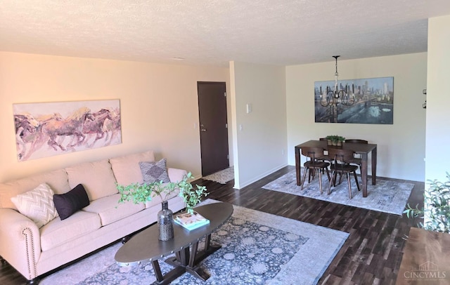 541 Davis Rd Unit 8, Pierce Twp, OH 45255 - living area featuring a chandelier, wood finished floors, and a textured ceiling