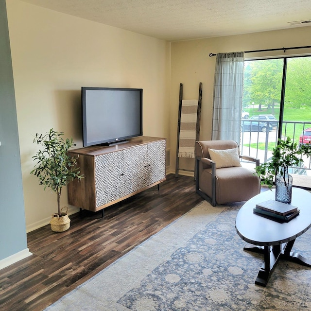 541 Davis Rd Unit 8, Pierce Twp, OH 45255 - living area featuring wood finished floors and a textured ceiling