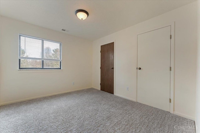 541 Davis Rd Unit 8, Pierce Twp, OH 45255 - unfurnished bedroom featuring carpet floors and baseboards