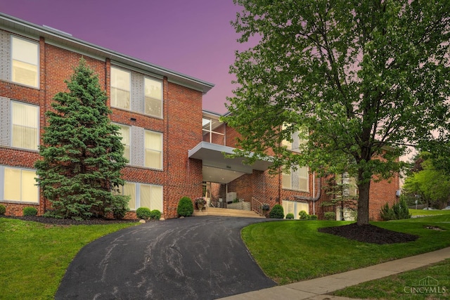 3566 Amberacres Dr Unit 1, Cincinnati, OH 45237 - property at dusk featuring asphalt driveway
