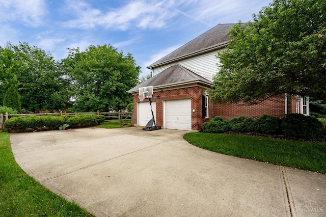 5088 Harvestdale Dr, Mason, OH 45040 - view of property exterior with brick siding, driveway, and a garage