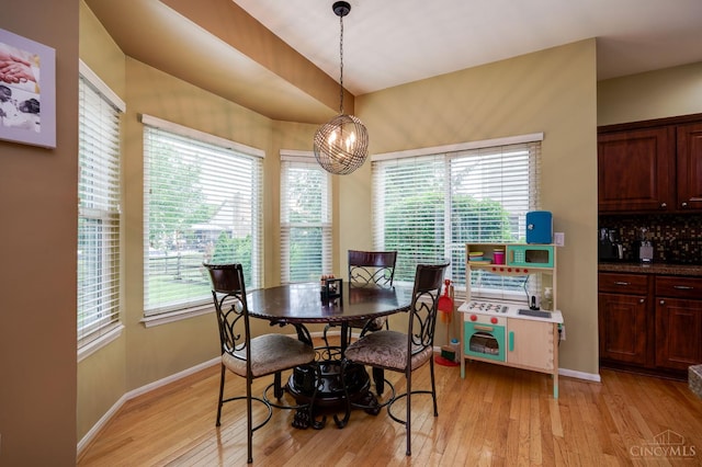 5088 Harvestdale Dr, Mason, OH 45040 - dining space with light wood-style floors and a chandelier