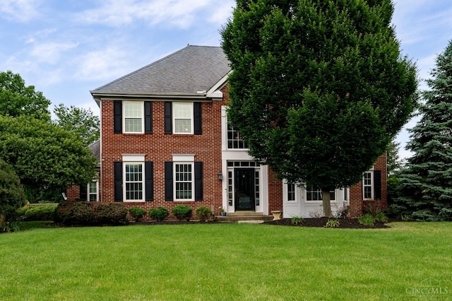 5088 Harvestdale Dr, Mason, OH 45040 - colonial inspired home with a front yard, brick siding, and a shingled roof