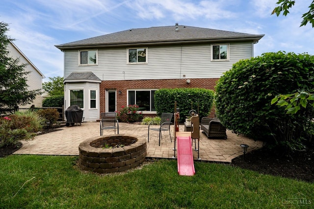 5088 Harvestdale Dr, Mason, OH 45040 - back of property with an outdoor fire pit, a patio, a lawn, and brick siding