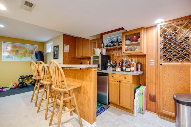 5088 Harvestdale Dr, Mason, OH 45040 - indoor wet bar with dishwasher, recessed lighting, wood walls, and light tile patterned floors