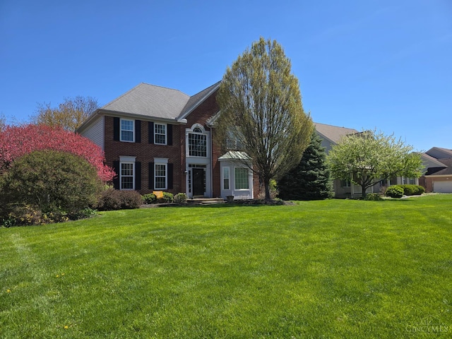 5088 Harvestdale Dr, Mason, OH 45040 - colonial house with a front lawn and brick siding
