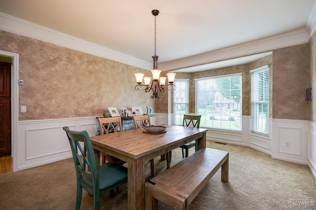 5088 Harvestdale Dr, Mason, OH 45040 - dining room with carpet, a chandelier, crown molding, a wainscoted wall, and a decorative wall
