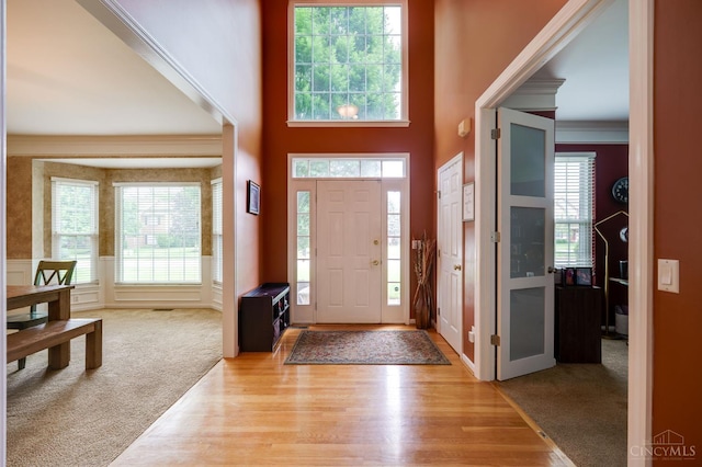 5088 Harvestdale Dr, Mason, OH 45040 - carpeted foyer with ornamental molding and wood finished floors