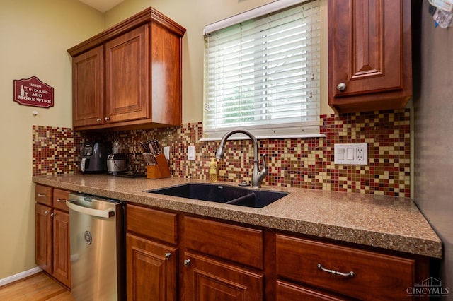 5088 Harvestdale Dr, Mason, OH 45040 - kitchen featuring dishwasher, decorative backsplash, brown cabinets, and dark countertops