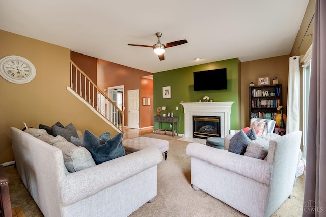 5088 Harvestdale Dr, Mason, OH 45040 - living area featuring stairway, carpet floors, ceiling fan, and a fireplace with flush hearth