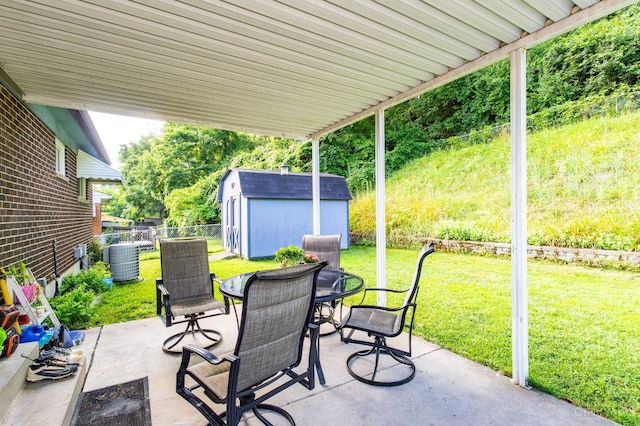 4321 Delhi, Delhi Twp, OH 45238 - view of patio / terrace with a storage unit and outdoor dining space