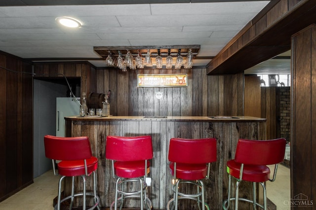 4321 Delhi, Delhi Twp, OH 45238 - indoor dry bar with wood walls, freestanding refrigerator, and carpet