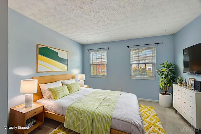 10854 Ponds Ln Unit 8, Sycamore Twp, OH 45242 - bedroom featuring a textured ceiling and carpet floors