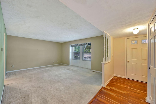 10854 Ponds Ln Unit 8, Sycamore Twp, OH 45242 - entrance foyer featuring a textured ceiling and wood finished floors