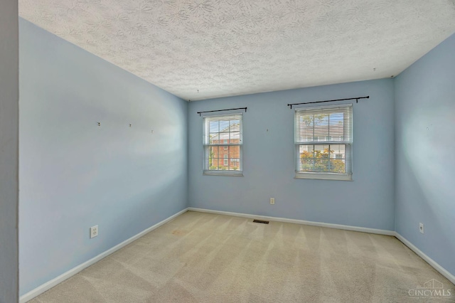 10854 Ponds Ln Unit 8, Sycamore Twp, OH 45242 - empty room with carpet flooring and a textured ceiling