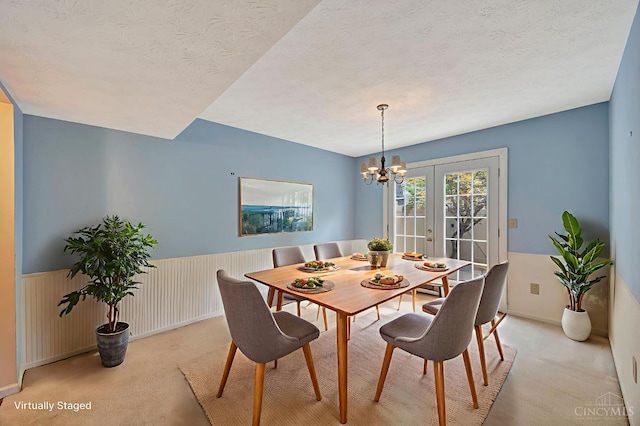 10854 Ponds Ln Unit 8, Sycamore Twp, OH 45242 - dining area with light colored carpet, a chandelier, and a textured ceiling