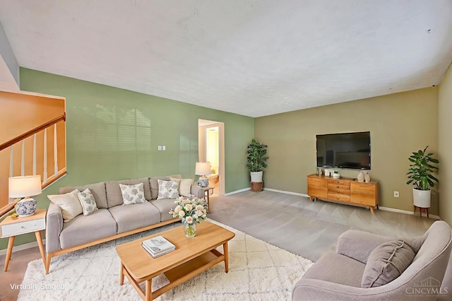 10854 Ponds Ln Unit 8, Sycamore Twp, OH 45242 - carpeted living room with baseboards and stairs