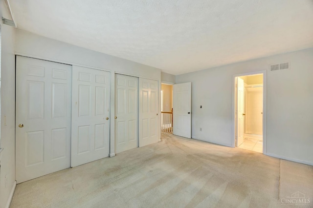 10854 Ponds Ln Unit 8, Sycamore Twp, OH 45242 - unfurnished bedroom with carpet flooring, multiple closets, and ensuite bathroom