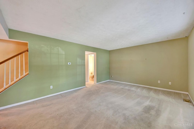 10854 Ponds Ln Unit 8, Sycamore Twp, OH 45242 - carpeted spare room featuring stairway and a textured ceiling
